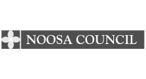 The image displays the logo of Noosa Council, featuring a white stylized floral emblem on a dark gray background. Next to it, "NOOSA COUNCIL" is elegantly written in white, signifying their commitment to community initiatives like work health and safety courses.